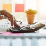 Close up view of bookkeeper or financial inspector hands making report, calculating or checking balance. Home finances, investment, economy, saving money or insurance concept