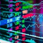 Financial data on a monitor,candle stick graph of stock market ,